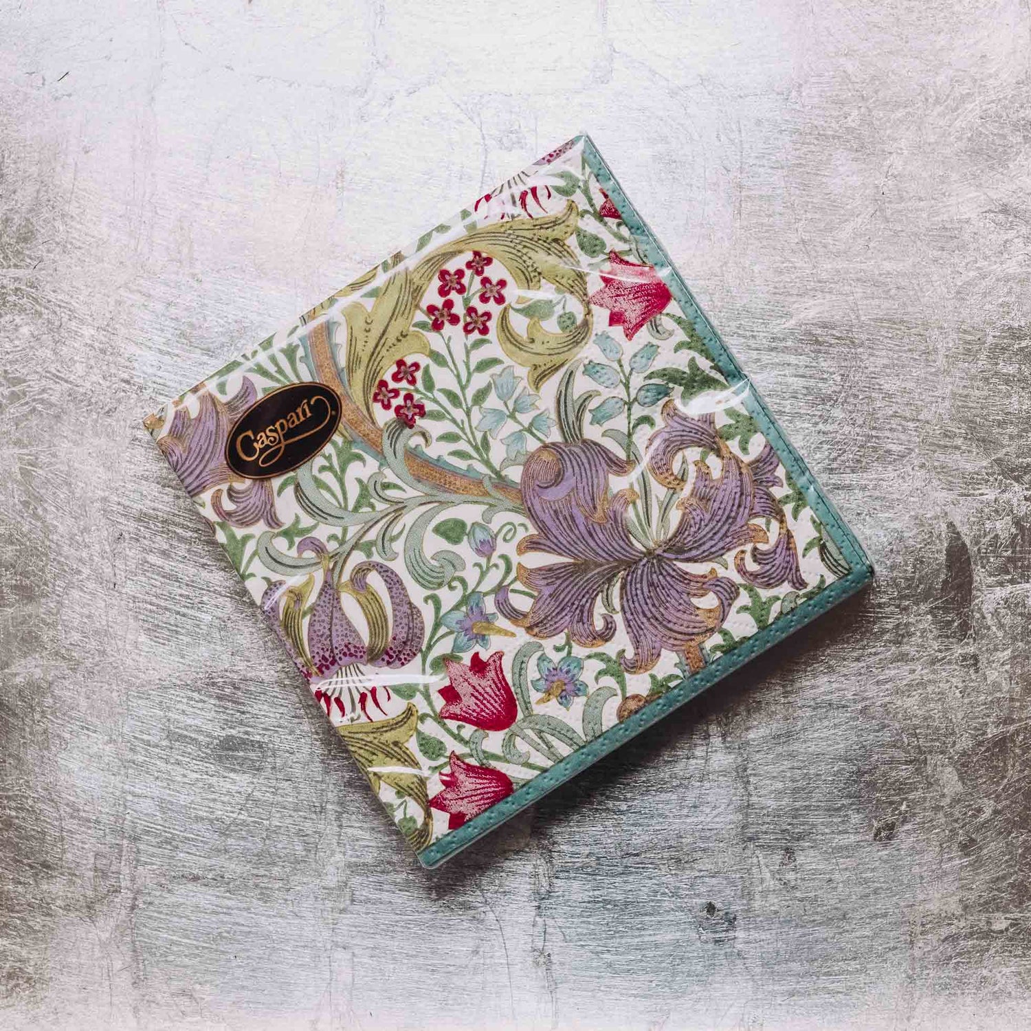 Indulge in luxury with our Caspari triple-ply Cocktail Napkins. Made in Germany, these napkins feature exquisite artwork and designs from around the world, printed with nontoxic, water-soluble dyes and food-safe ink. Elevate your entertaining with sophistication and taste. Comes in sets of 20 napkins in 17 different designs.