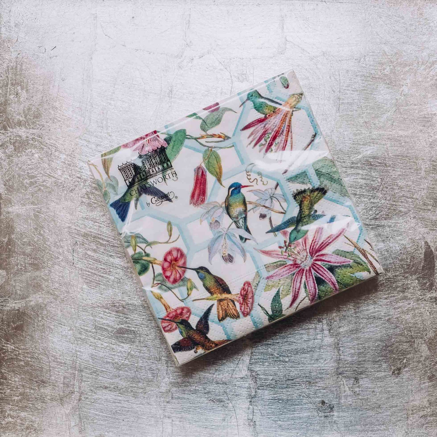 Indulge in luxury with our Caspari triple-ply Cocktail Napkins. Made in Germany, these napkins feature exquisite artwork and designs from around the world, printed with nontoxic, water-soluble dyes and food-safe ink. Elevate your entertaining with sophistication and taste. Comes in sets of 20 napkins in 17 different designs.